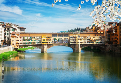 Poster famous bridge Ponte Vecchio over waters of river Arno, Florence at spring day, I