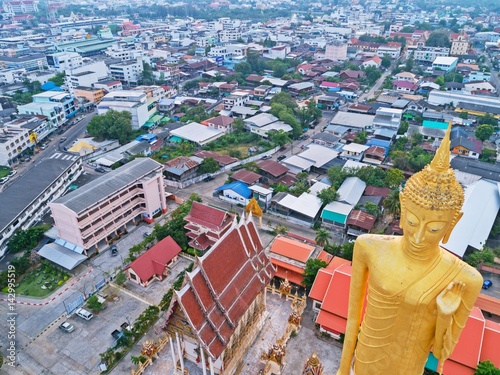 Poster Aerial view of TALLEST STANDING BUDDHA IMAGAE IN Roiet, THAILAND - BURAPAPIRAM T