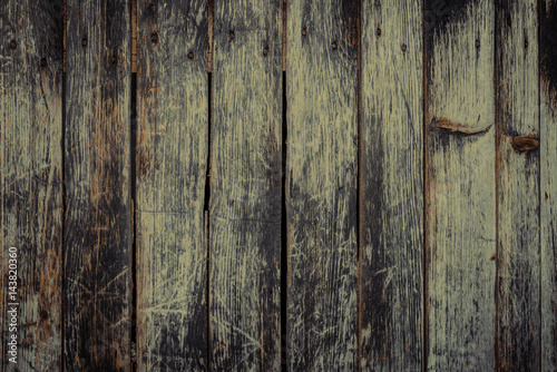 Fototapeta Old rural wooden wall in dark colors, detailed plank photo texture. Natural wooden building structure background.