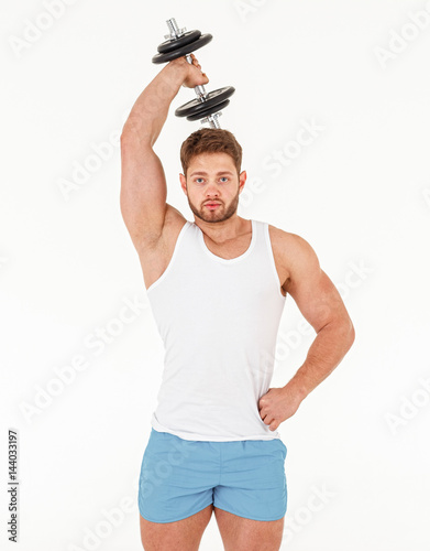 Poster Muscular bodybuilder guy doing exercises with dumbbell isolated on white backgro