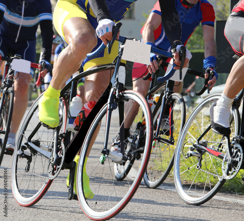 fast cyclists on racing bikes run during the sports competition