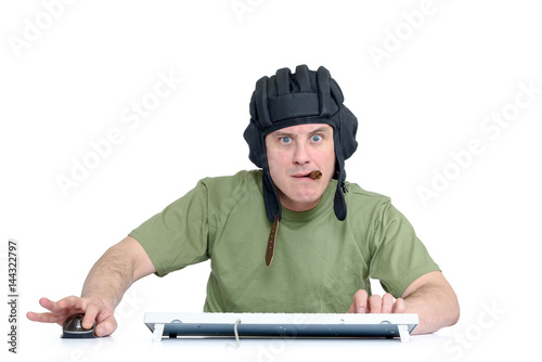 Poster Funny man in tank helmet and cigar playing in game, sitting front of computer