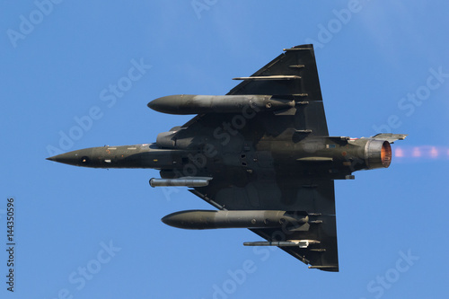 Fast green air force fighter jet flyby