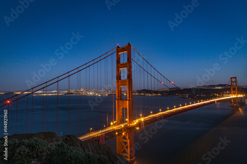 Poster Aerial view of the Golden Gate bridge in San Fransisco during golden hour and tr