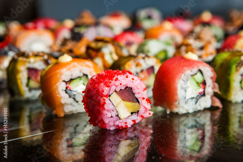 Various kind of sushi food served on black background. Best Types of Sushi Rolls