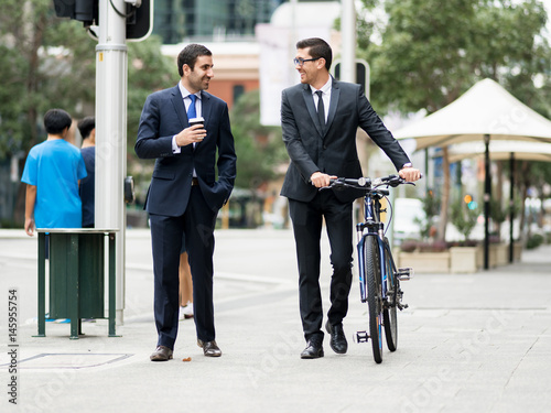 Young businessmen with a bike