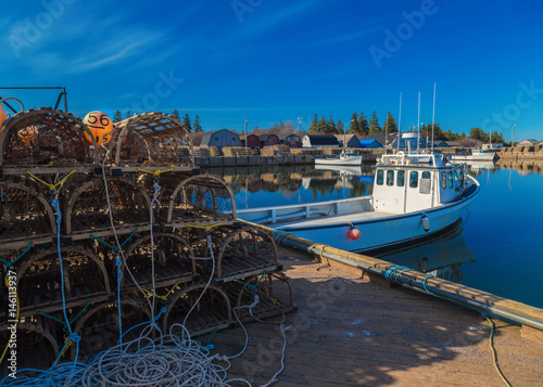 Commercial fishing boats at a wharf in rural Prince Edward Island, Canada.