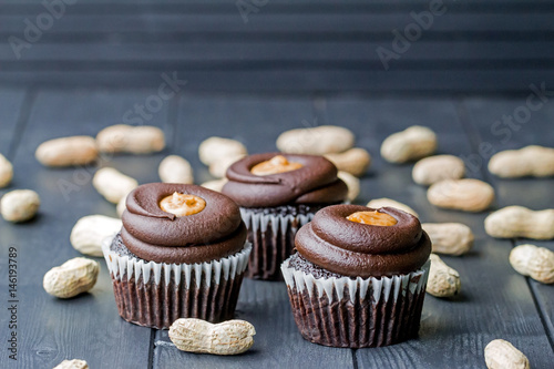 Poster Chocolate cupcakes filled with peanut butter and topped with chocolate mousse