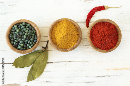 Spices and herbs on wooden background