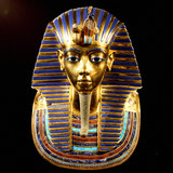 Replica of funerary mask of Tutankhamun. Isolated on black background. The same or very similar to the original