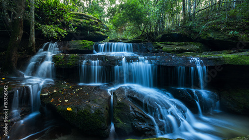 Fototapeta Breathtaking waterfall at tropical forest ,Located Phukradueng international park, Loei Province, Thailand