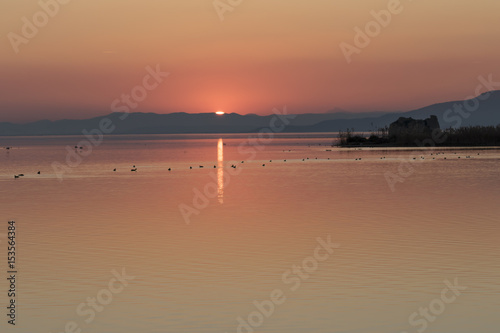 Poster Puesta de sol en la Torre de San Juan en el Parque Natural del Delta del Ebro