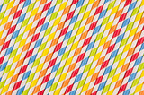 Abstract multicolored rainbow geometric striped background of beverage straw.