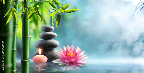  Spa - Natural Alternative Therapy With Massage Stones And Waterlily In Water
