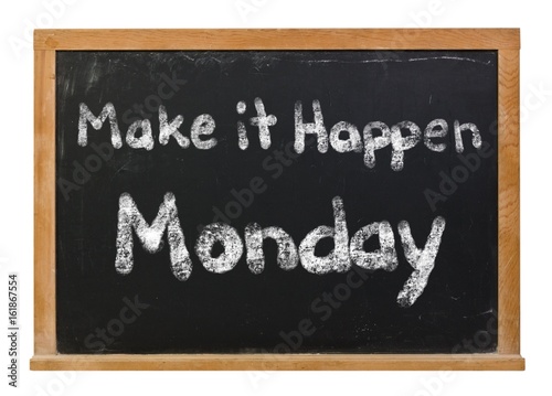 Make it happen Monday written in white chalk on a black chalkboard isolated on white
