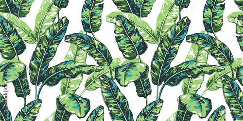  Tropical seamless pattern with palm leaves.