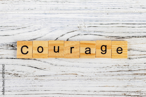 COURAGE word made with wooden blocks concept