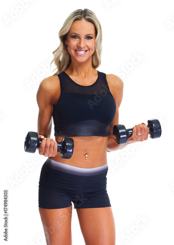 Young woman with dumbbells © Kurhan