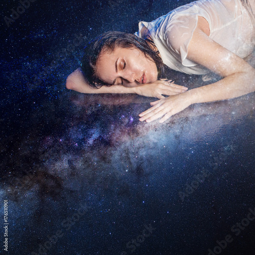 Photo art, young woman dreams to starry sky. Elements of this image furnished by NASA.