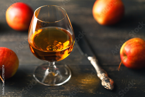 Glass of whiskey on a wooden background