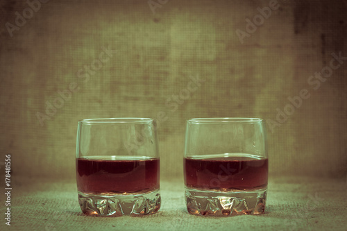 Two full of stacks of whiskey without ice.