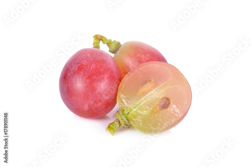 whole and half cut fresh grapes on white background
