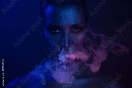 Vape Party, Nightlife. Beautiful Sexy Woman smoking