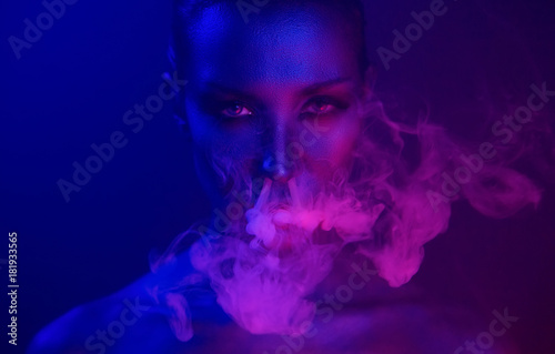 Vape Party, Nightlife. Beautiful Sexy Woman smoking