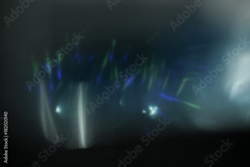 Real Lens flare light effect. Sparkle ray leak on black background. Optical effect of spotlight. Flash leak beam.