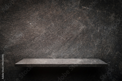 Dark rustic cement shelf display for product © junce11