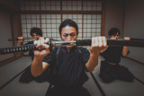Samurai training in a traditional dojo, in Tokyo