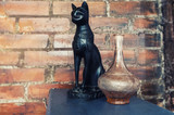 The figure of a black cat