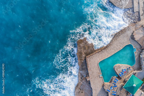 Aerial view of the coast of Montenegro. Storm waves on the Ploče beach.