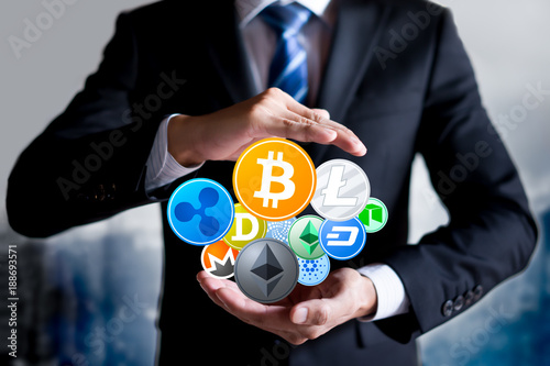 Cryptocurrency security concept. Businessman with protective gesture and set of cryptocurrencies. © Worawut