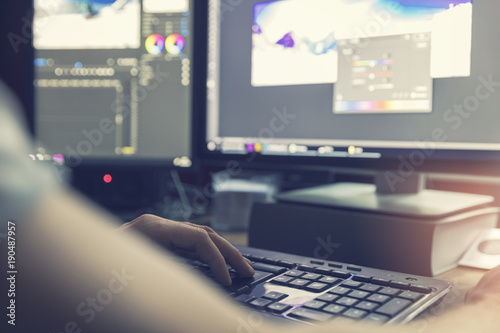 post production - man doing photo and video editing on computer