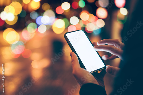 Man using smartphone outdoors