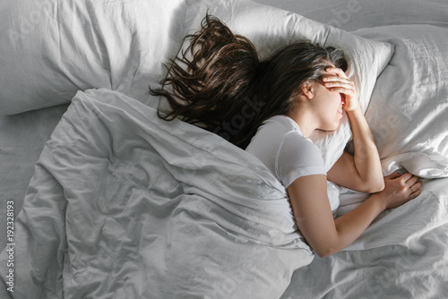woman sleep in bed sunshine thought the window