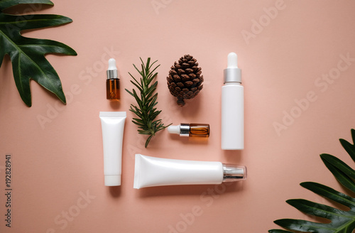 natural cosmetic cream , serum, skincare blank bottle packaging with leaves herb, wood . bio organic product.beauty and spa concept. © paulynn