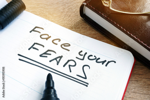 Face your fears written in a note.