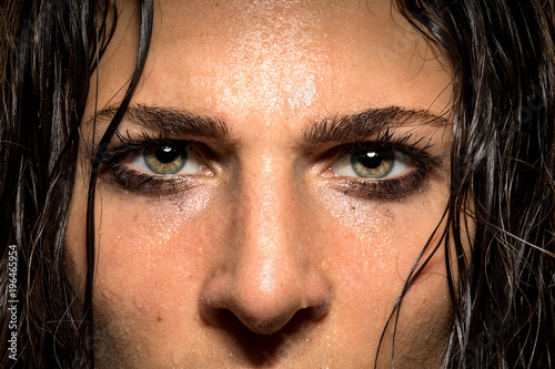 Expression in female athlete eyes showing focus, determination, conviction, power, courage