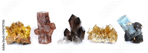 A row of five crystal clusters; Mimetite, Aragonite, Smoky Quartz, Barite (Baryte) and Aquamarine with Tourmaline. © Daniel