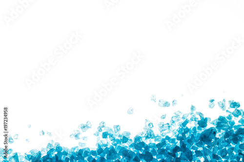 Blue crystals of sea salt on white background © TanyaJoy