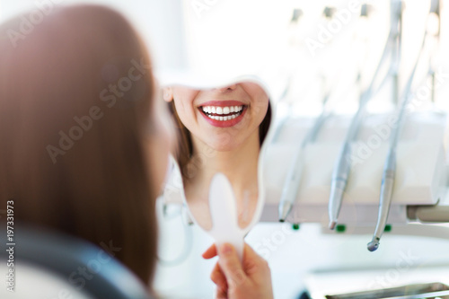 Woman having teeth examined at dentists © pikselstock