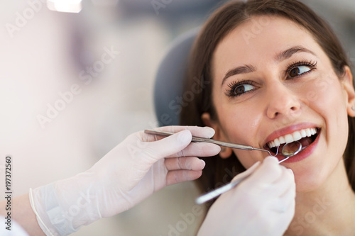 Woman having teeth examined at dentists © pikselstock