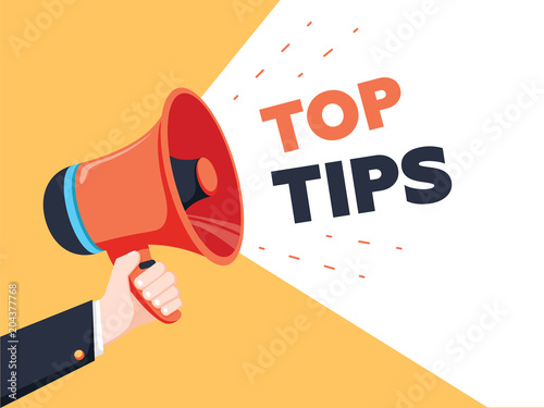 Male hand holding megaphone with Top Tips speech bubble. Loudspeaker. Banner for business, marketing and advertising.