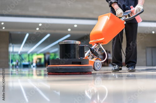 cleaning floor with machine © THINK b