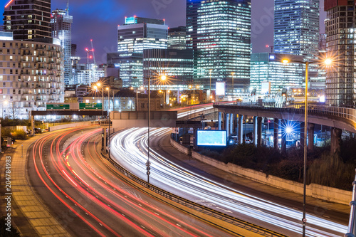 City night view with skyscrapers and traffic light trails