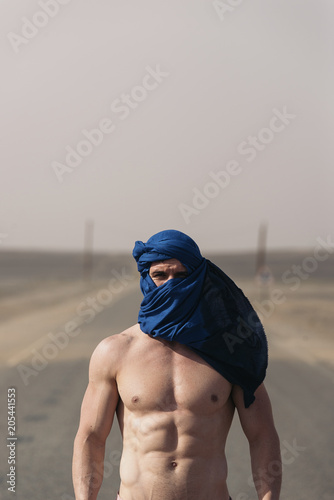 Portrait of caucasian man with turban looking at camera. © santypan