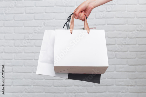 hand holding paper bag