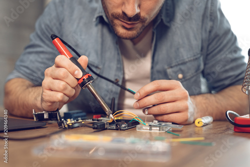 Engineer Working On Circuit Board © milanmarkovic78